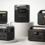 Top 5 safe indoor generators for apartment use displayed on white pedestals of varying heights: EcoFlow DELTA 2, Anker SOLIX C1000, EcoFlow RIVER 2 Max, Jackery Explorer 500, and Jackery Explorer 300 Plus in a professional studio setting
